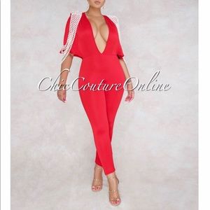 Red jumpsuit pearl detail on sleeves size large